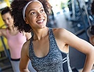 Photo of young woman at gym with great eyesight due to LASIK surgery